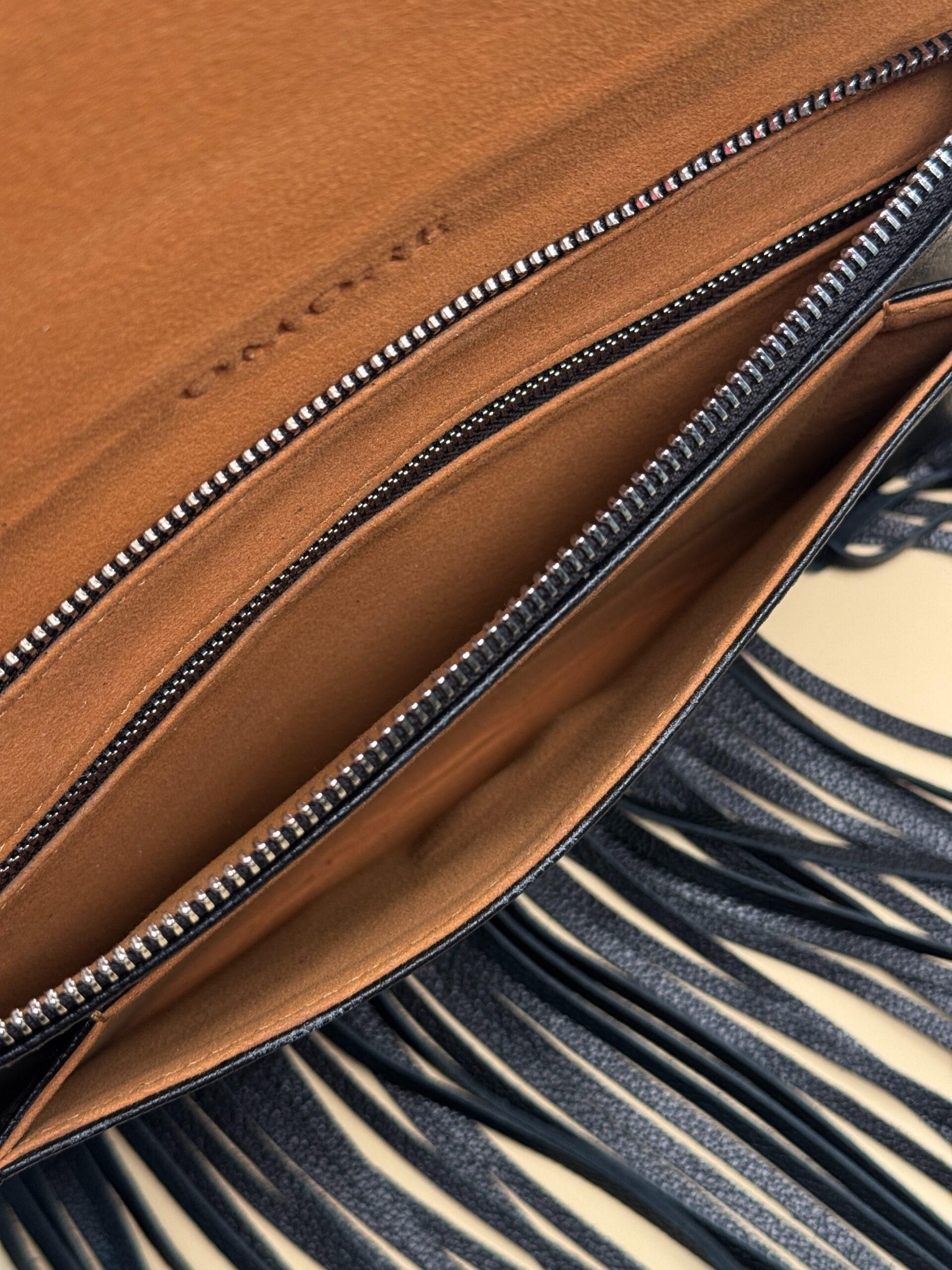 WI:RE clutch leather bag with fringe