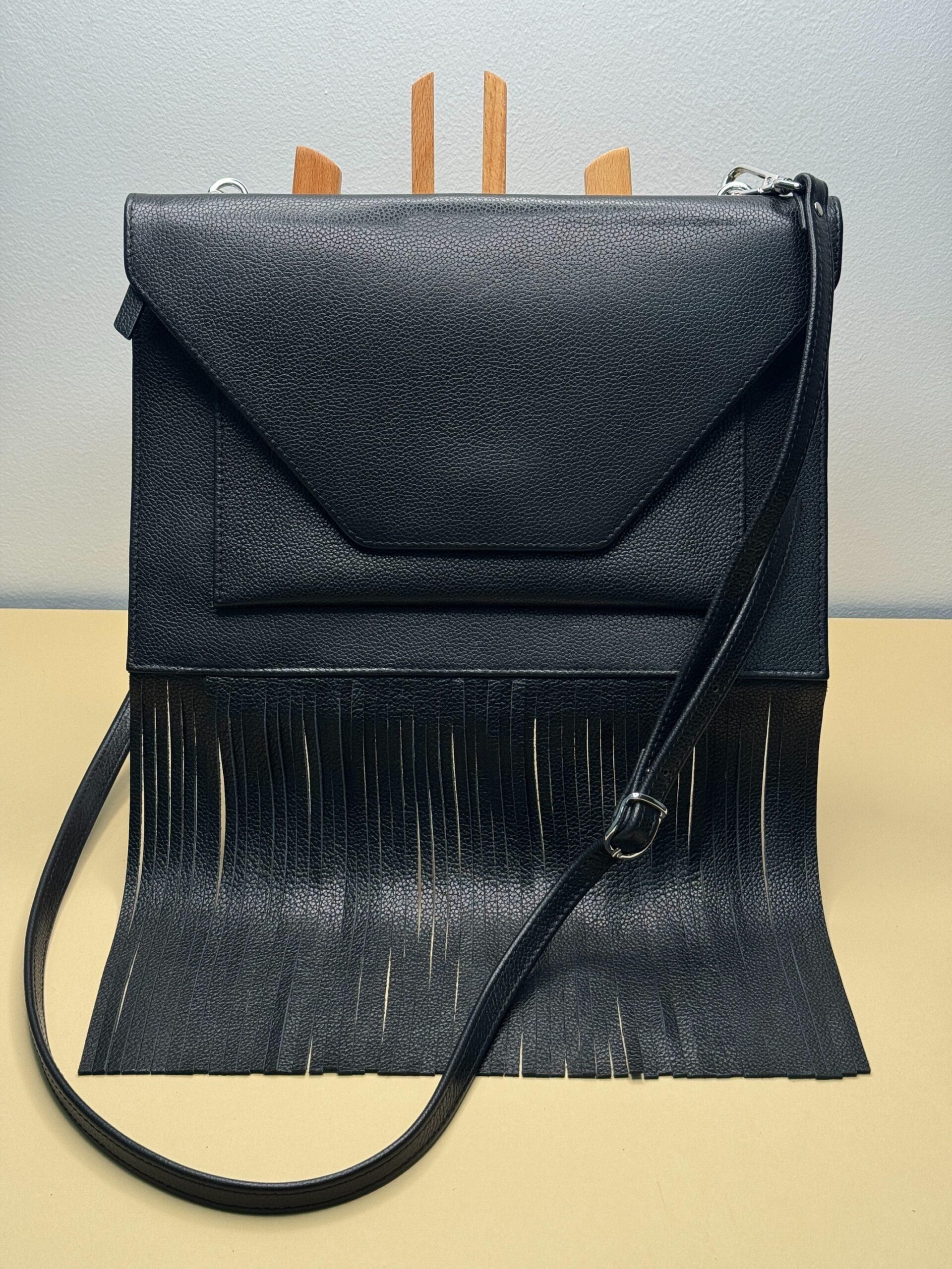 WI:RE clutch leather bag with fringe