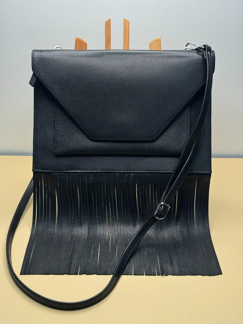 WI:RE clutch leather bag with fringe